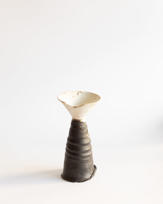 Handmade wheel-thrown goblet featuring a contrasting black and white glaze